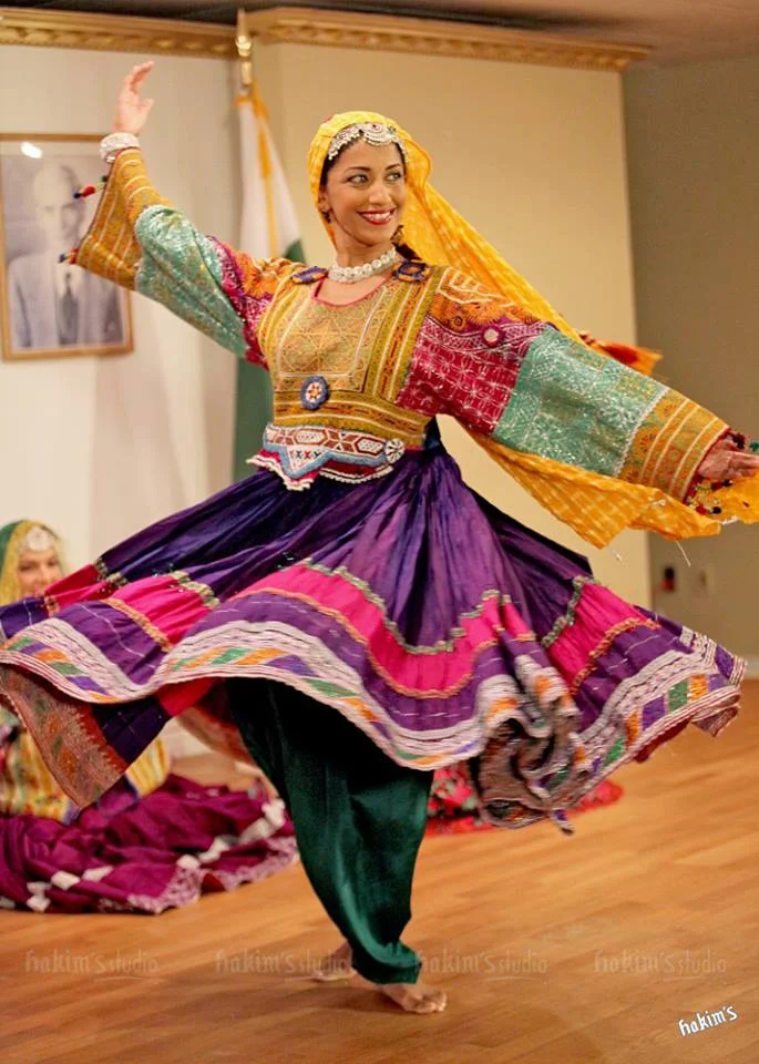 Sanam spinning in Sindhi costume