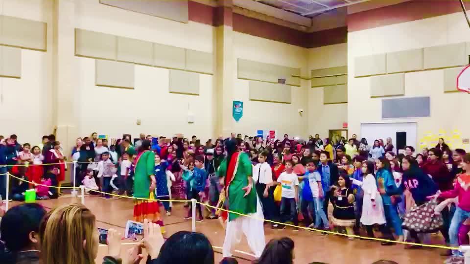 Sanam Studios Dancers leading a dance-along with students at an Alpharetta elementary school